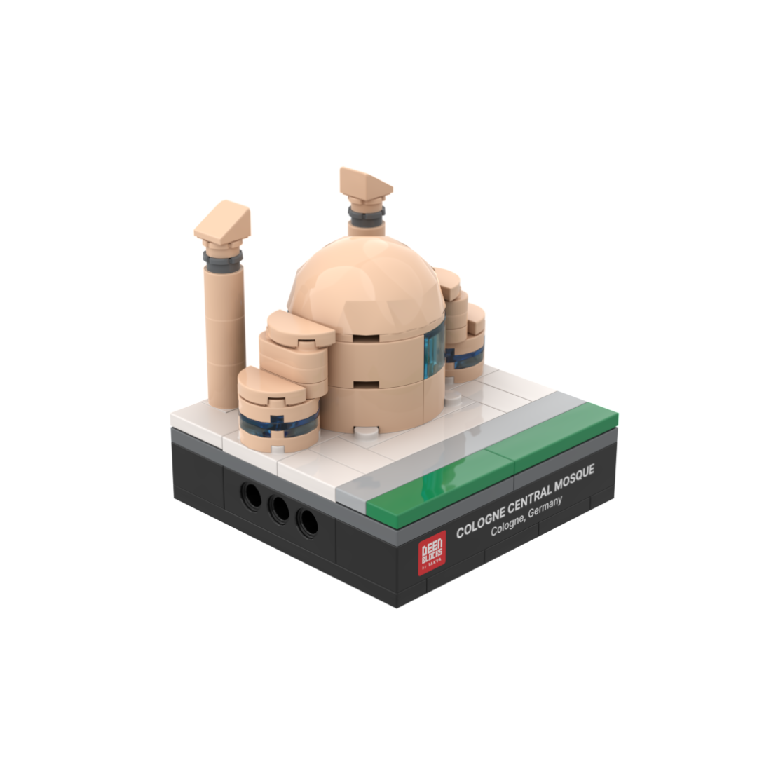 Cologne Central Mosque mini building blocks set, a desk-size Islamic collectible shown at an angle on white, featuring its sand-coloured shell dome, curved walls with blue glass bands and slanted-top minarets, set on a black DEENBLOCKS nameplate base